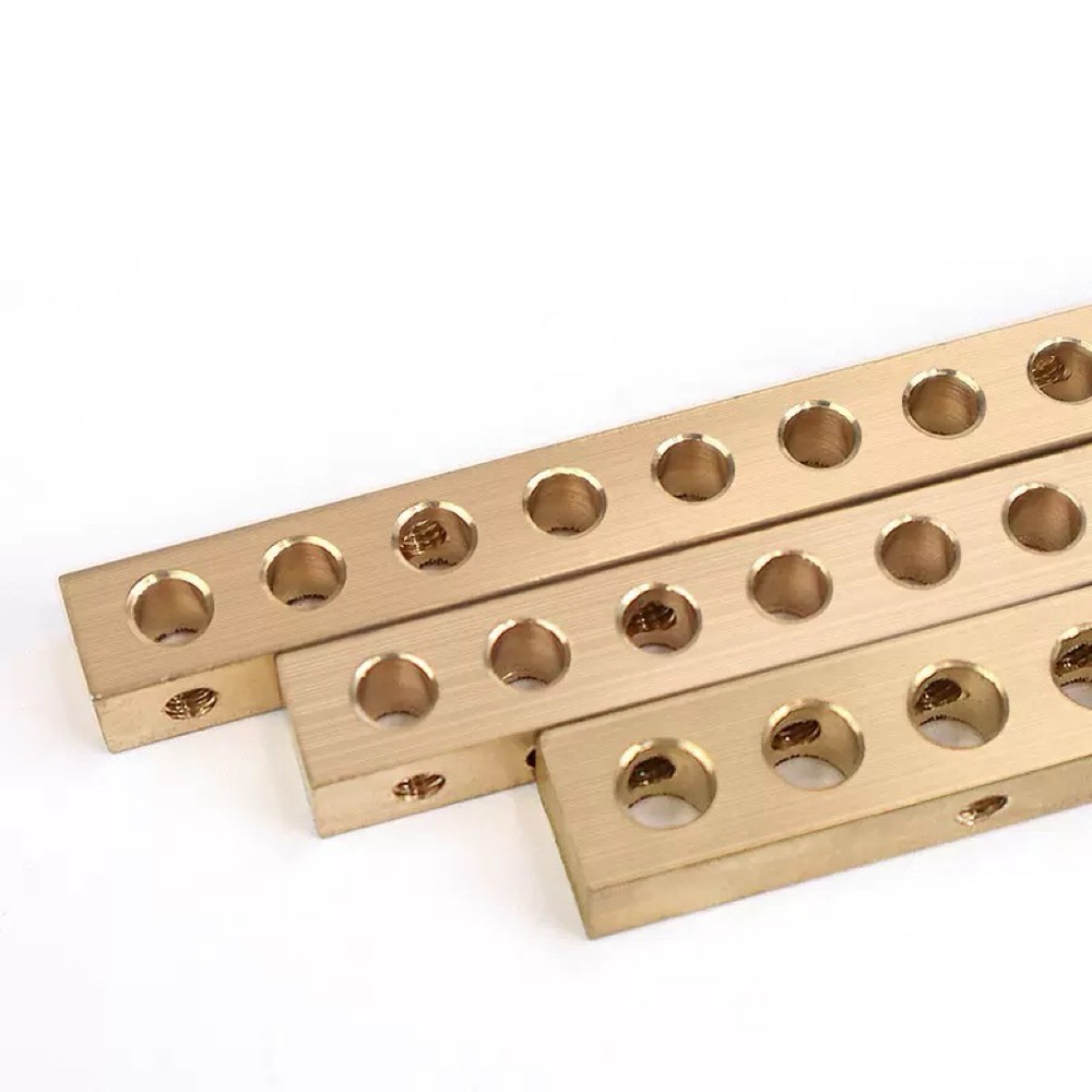 Grounding busbar machined holes